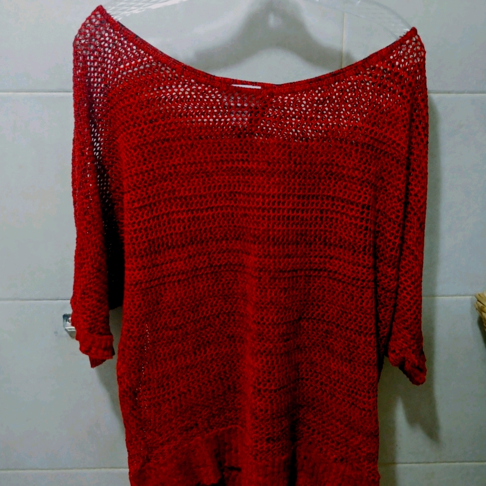Red and black blouse with open back.